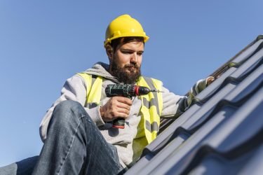 man-working-roof-front-view